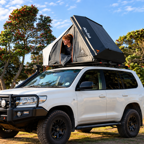 White Land Cruiser with Rooftop Tent