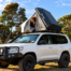 White Land Cruiser with Rooftop Tent